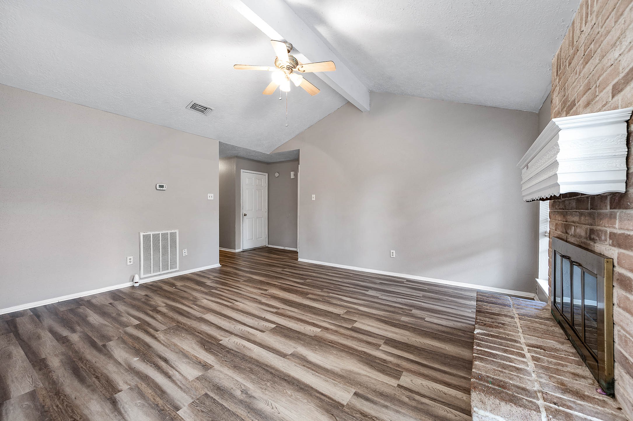 4918 Quailgate Drive Spring, TX 77373 - Photo 4 of 17 a view of a livingroom with wooden floor and a ceiling fan