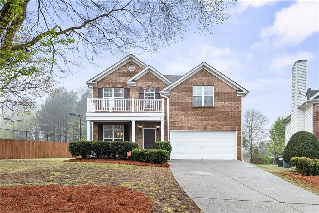 355 Ridgestone Drive Southwest Marietta, GA 30008 - Photo 1 of 1 a front view of a house with a yard