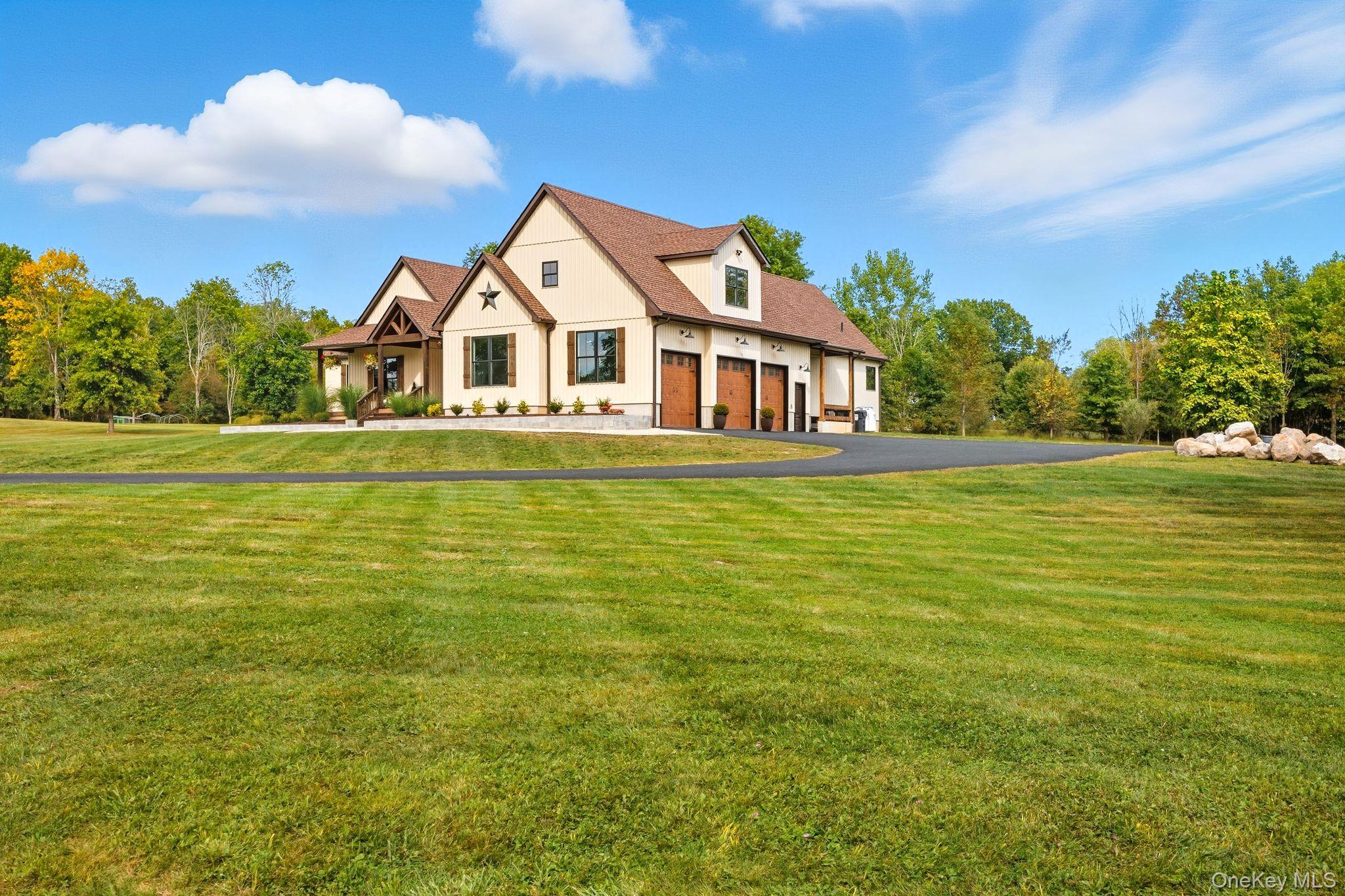 11 Knolls Road Wallkill, NY 12589 - Photo 11 of 48 a front view of a house with a garden