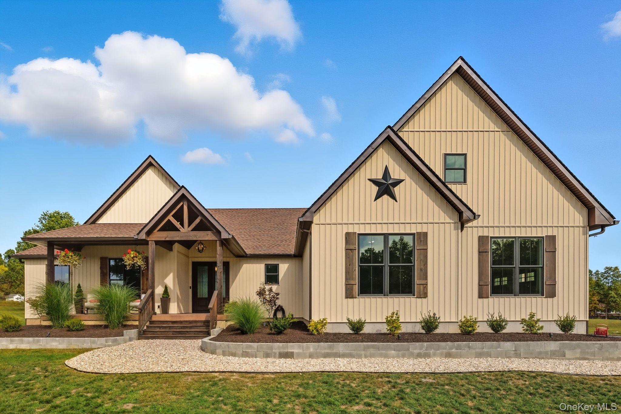 11 Knolls Road Wallkill, NY 12589 - Photo 14 of 48 a front view of a house with garden