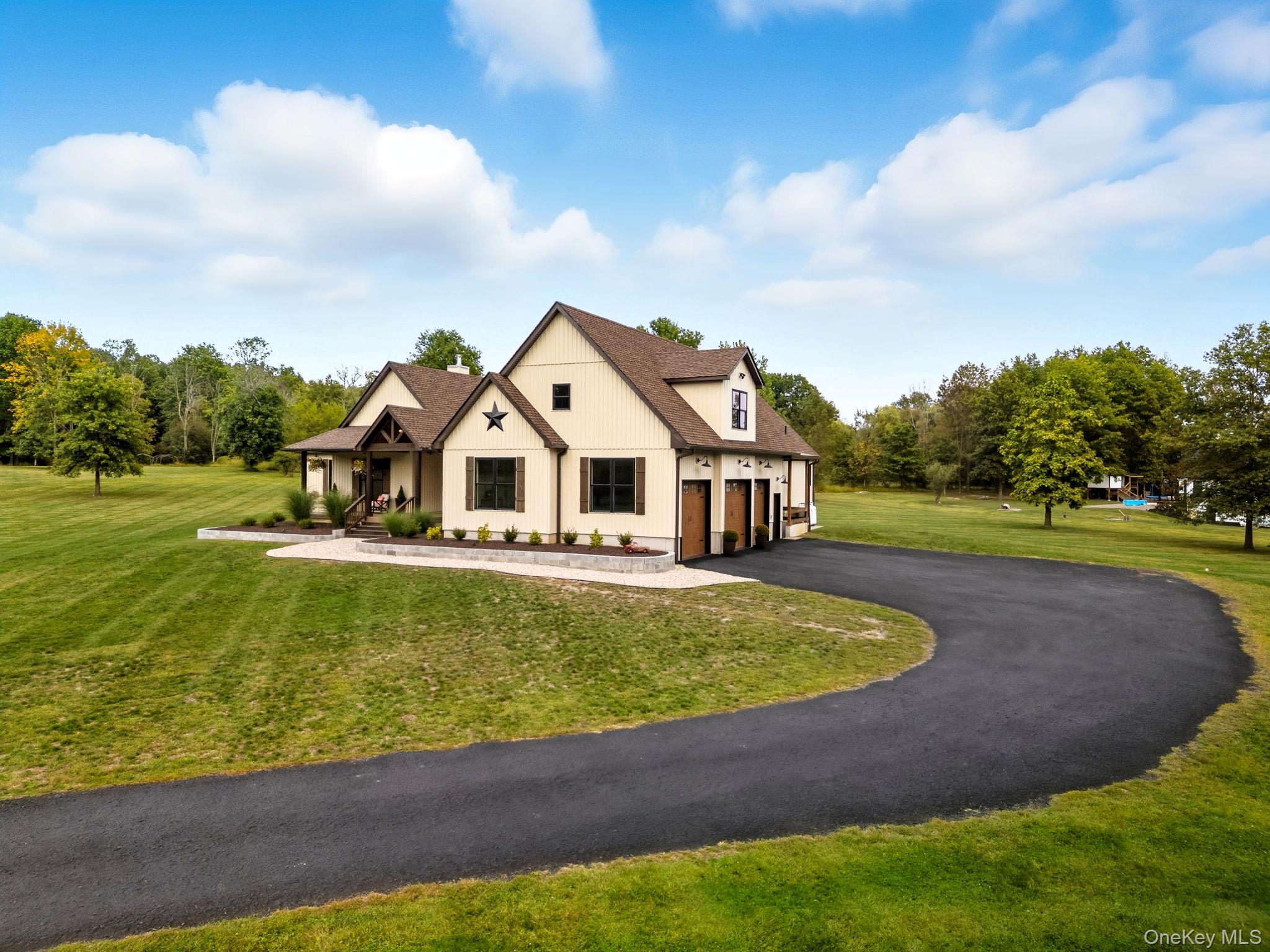 11 Knolls Road Wallkill, NY 12589 - Photo 2 of 48 a aerial view of a house with a yard table and chairs