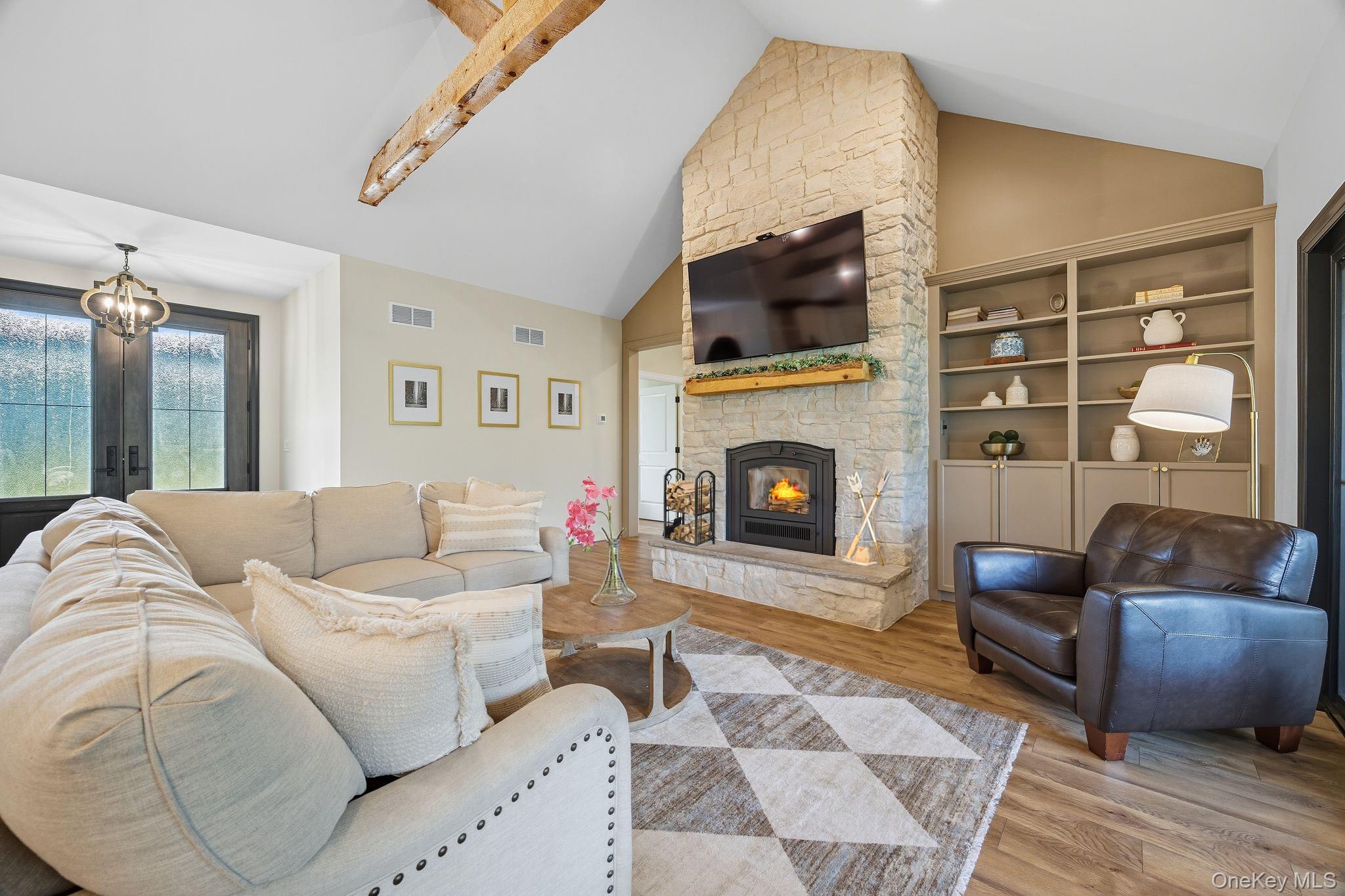 11 Knolls Road Wallkill, NY 12589 - Photo 22 of 48 a living room with furniture and a fireplace