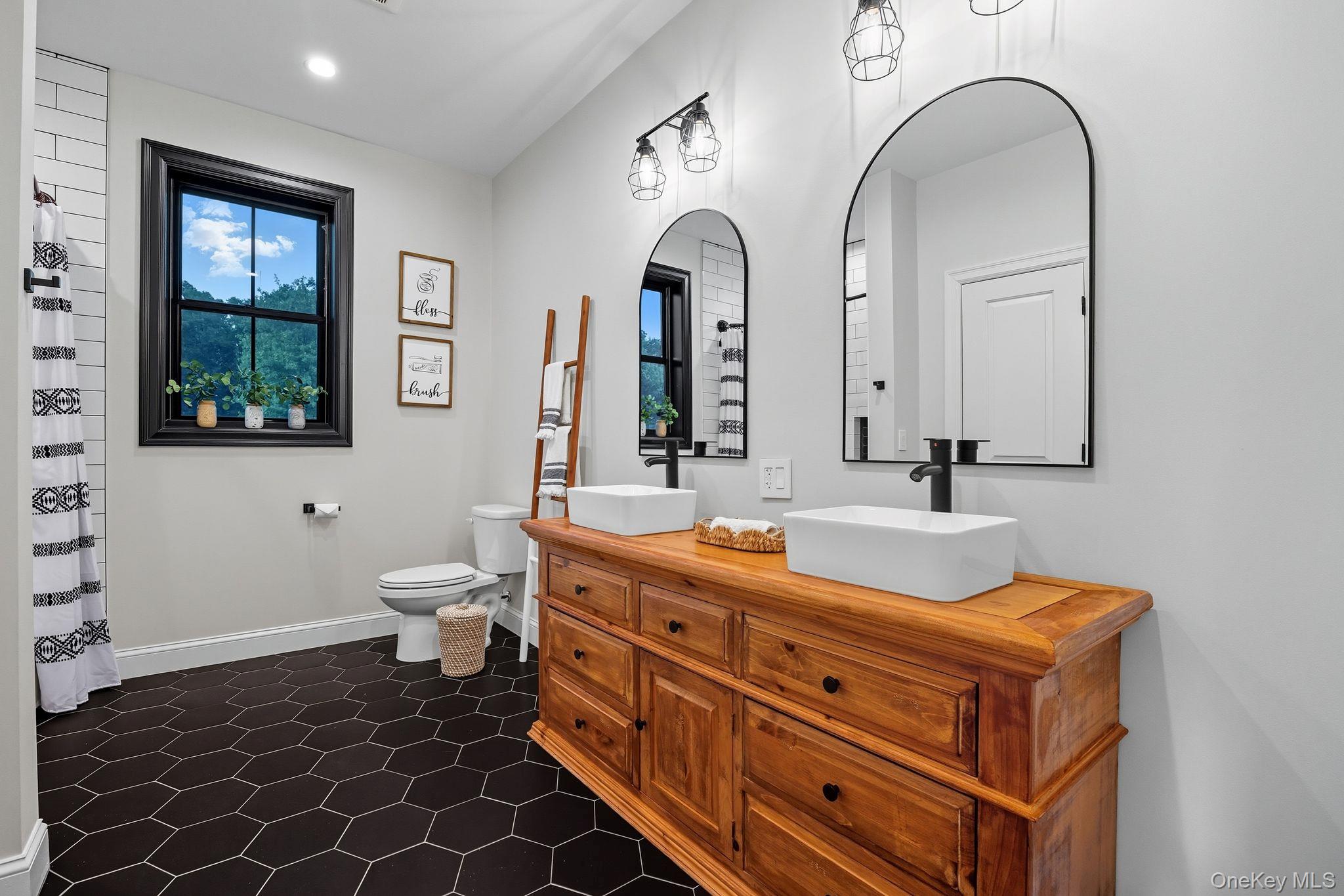 11 Knolls Road Wallkill, NY 12589 - Photo 29 of 48 a bathroom with a double vanity sink mirror and toilet