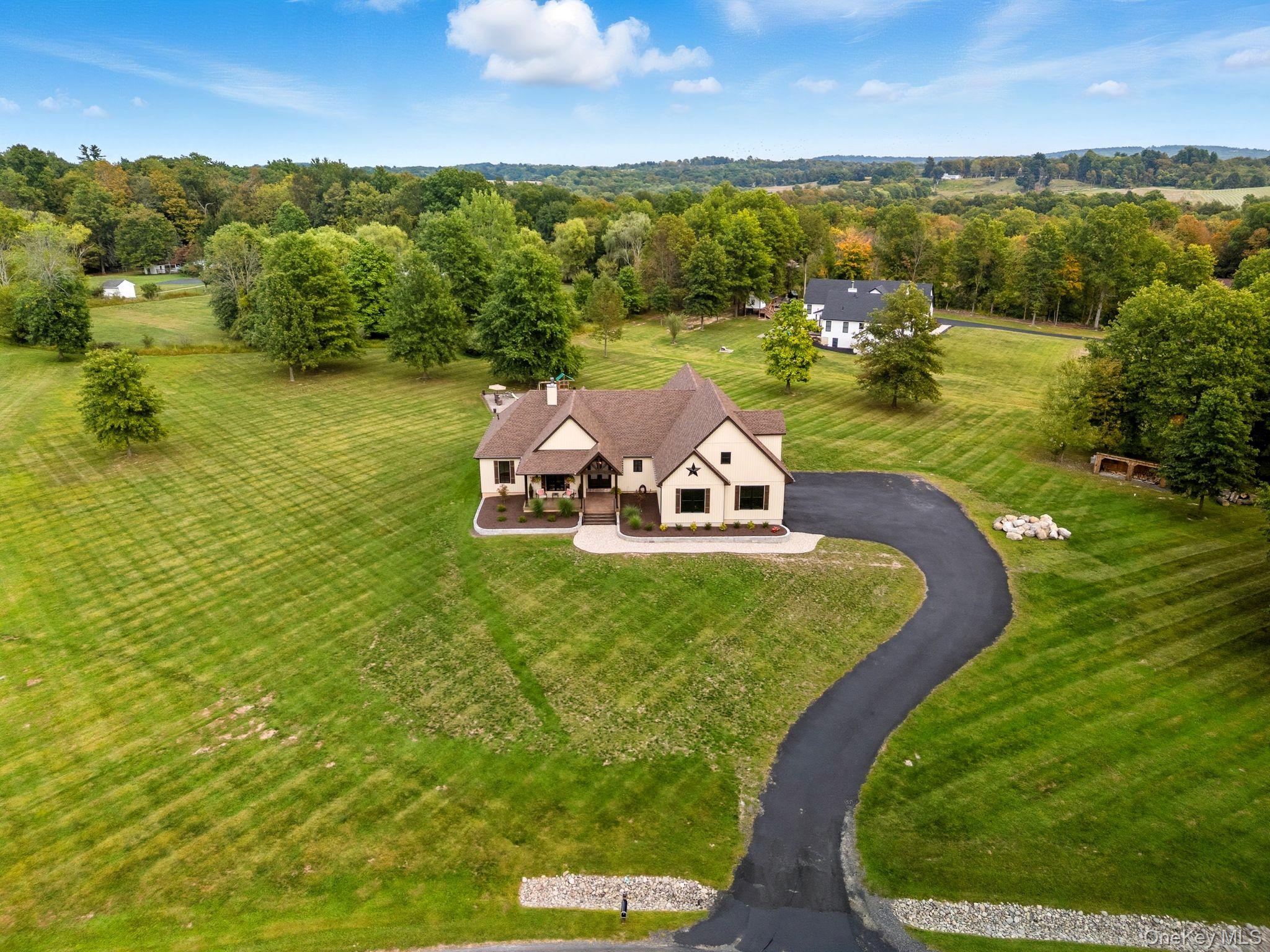 11 Knolls Road Wallkill, NY 12589 - Photo 3 of 48 an aerial view of a house with a garden and houses