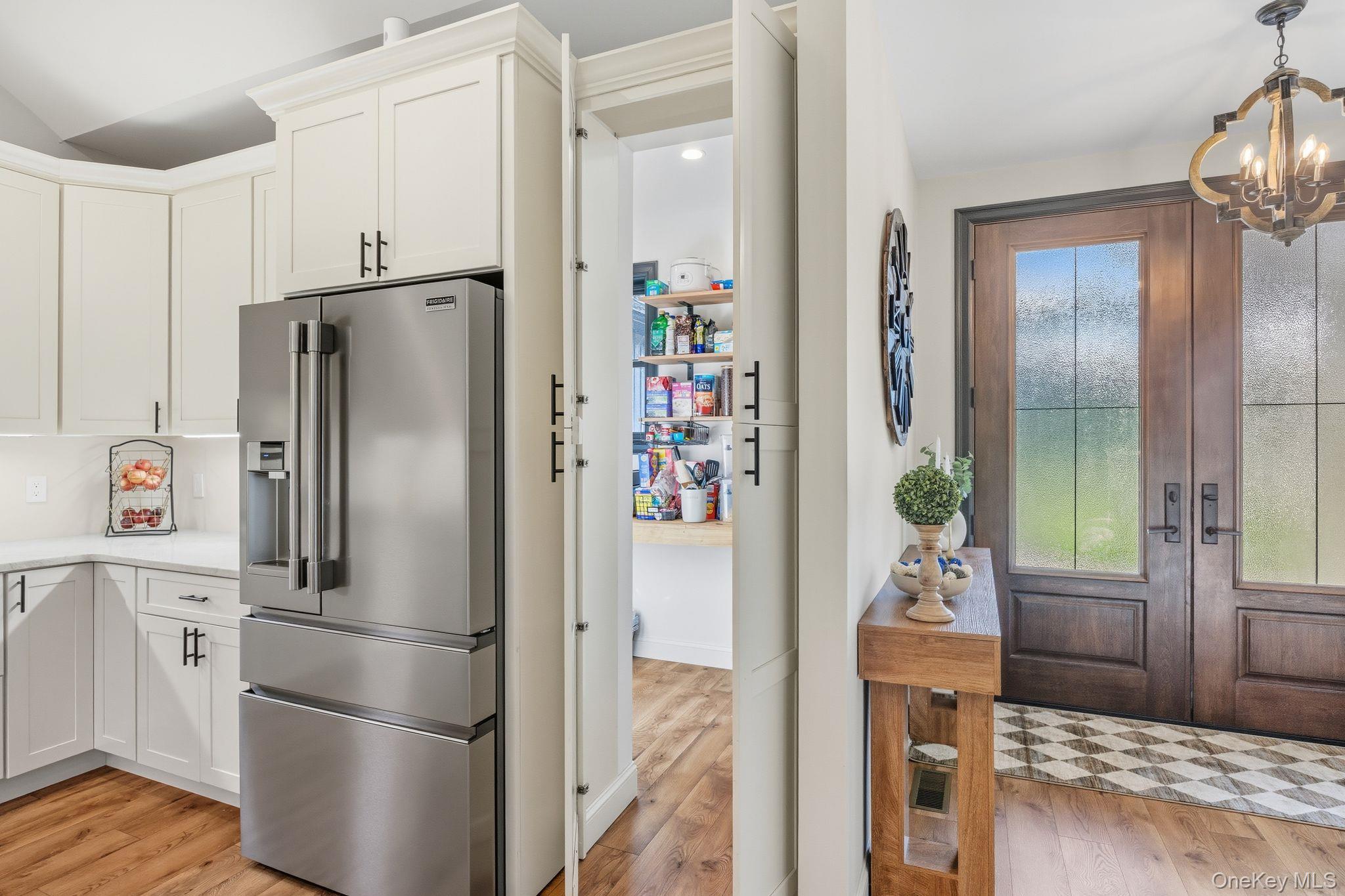 11 Knolls Road Wallkill, NY 12589 - Photo 35 of 48 a kitchen with stainless steel appliances a refrigerator and a wooden floor