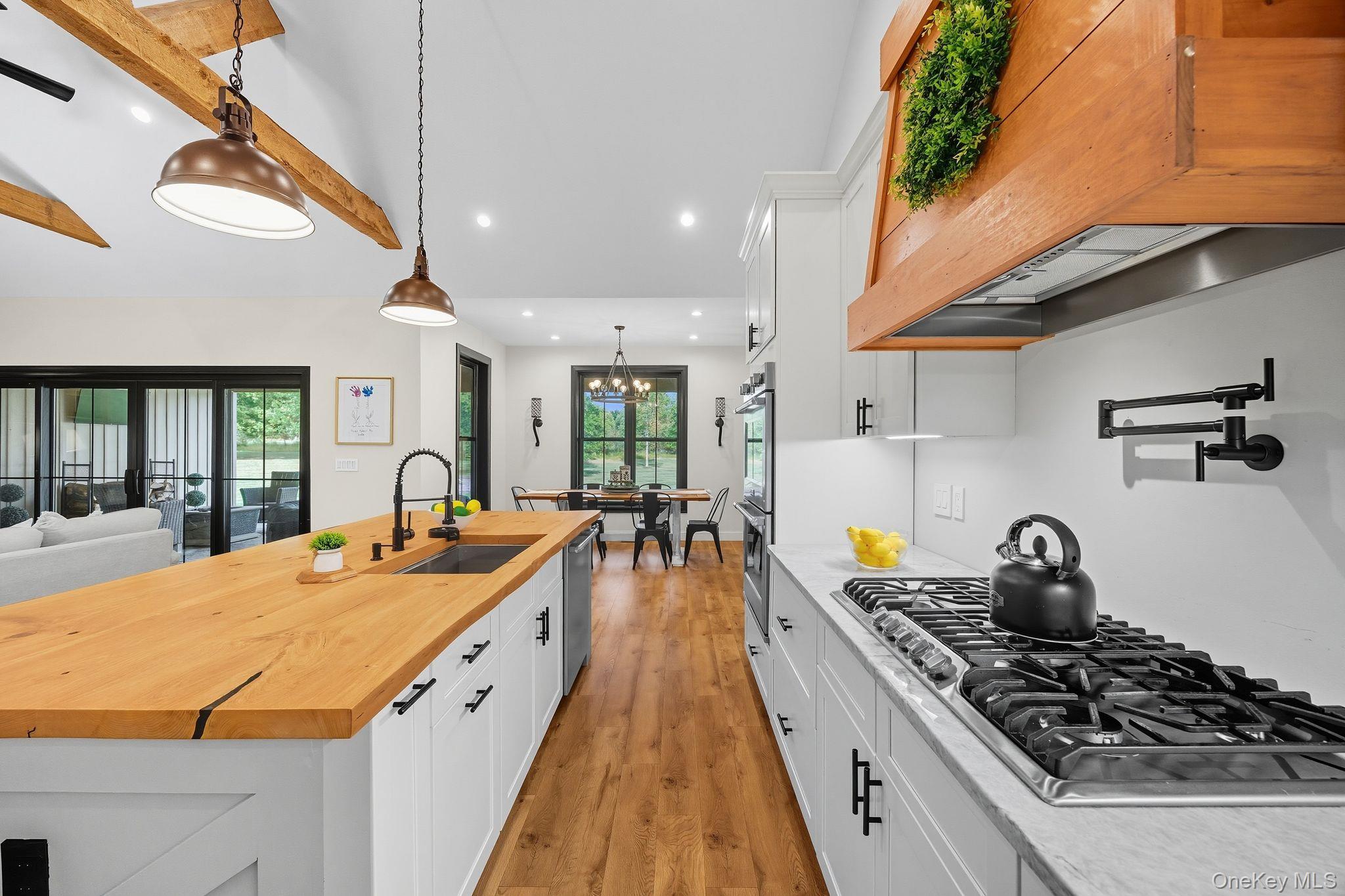 11 Knolls Road Wallkill, NY 12589 - Photo 37 of 48 a large kitchen with stainless steel appliances granite countertop a stove and a large window