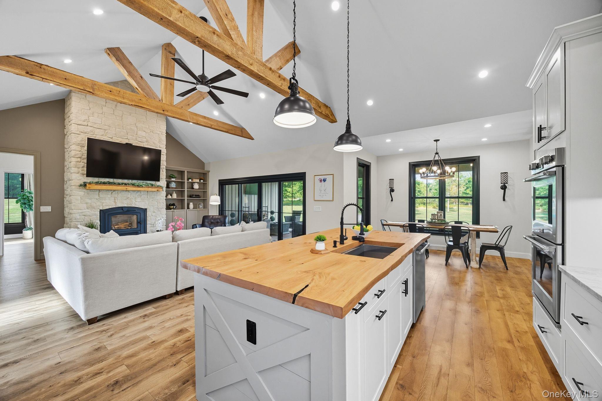 11 Knolls Road Wallkill, NY 12589 - Photo 38 of 48 a view of living room kitchen with furniture and flat screen tv