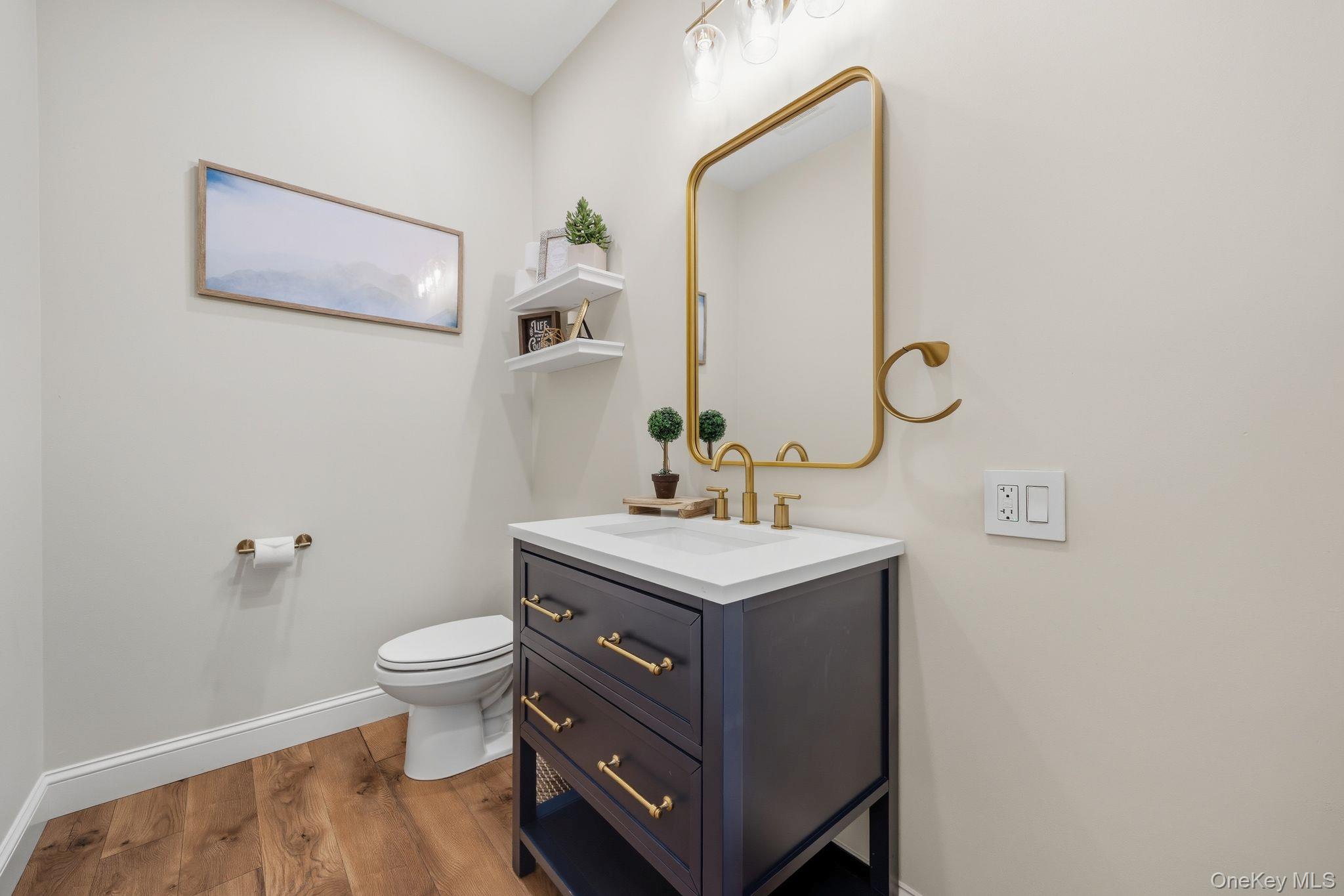 11 Knolls Road Wallkill, NY 12589 - Photo 40 of 48 a bathroom with a toilet a sink and mirror