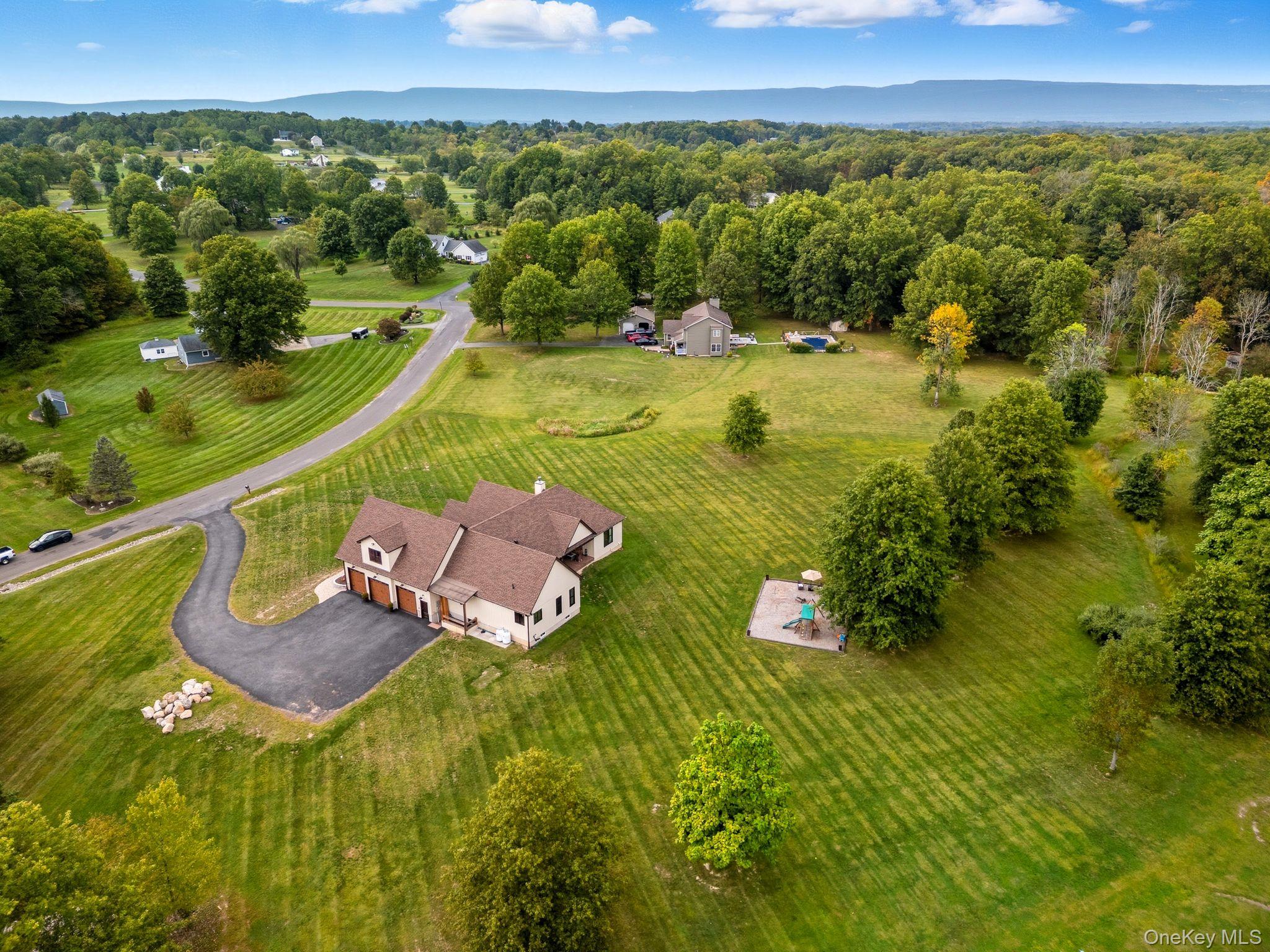 11 Knolls Road Wallkill, NY 12589 - Photo 8 of 48 a view of a swimming pool with a yard
