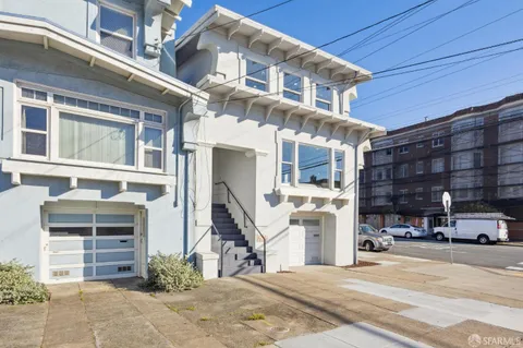 a front view of a building with parking space