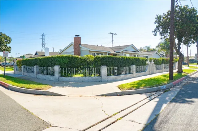 a view of a swimming pool with a patio and plants