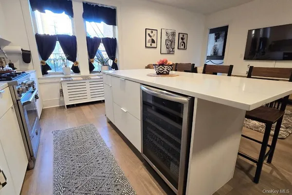 a en suite bathroom with a sink double vanity granite and a mirror