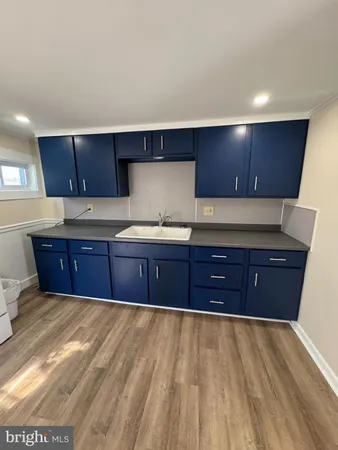 a kitchen with stainless steel appliances granite countertop a sink and cabinets