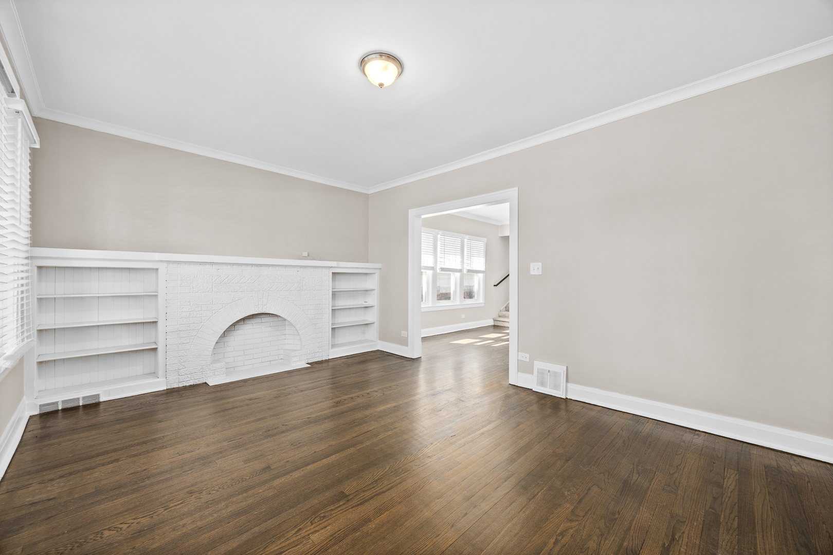6535 26th Place Berwyn, IL 60402 - Photo 5 of 26 a view of empty room with wooden floor and fan