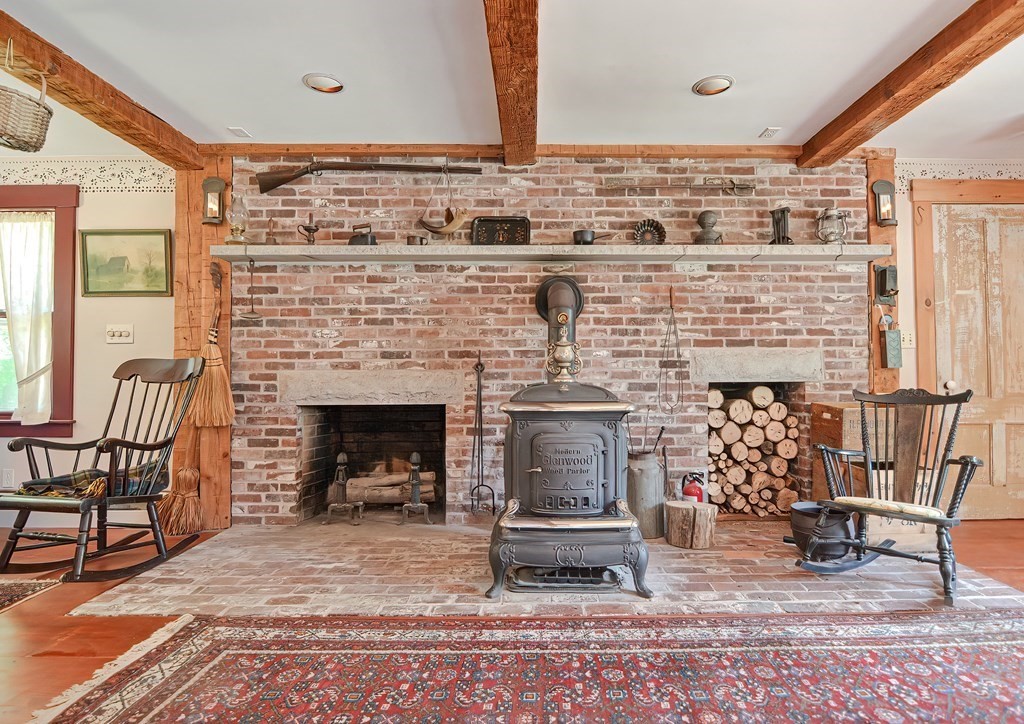 244 Davis Road Ashby, MA 01431 - Photo 11 of 35 a living room with furniture and a fireplace