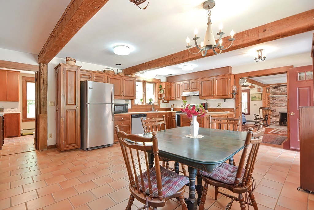 244 Davis Road Ashby, MA 01431 - Photo 12 of 35 a dining room with furniture and a view of kitchen