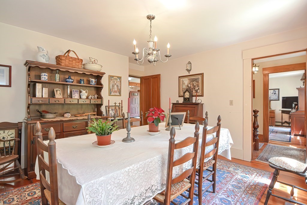 244 Davis Road Ashby, MA 01431 - Photo 17 of 35 a view of a dining room with furniture and chandelier