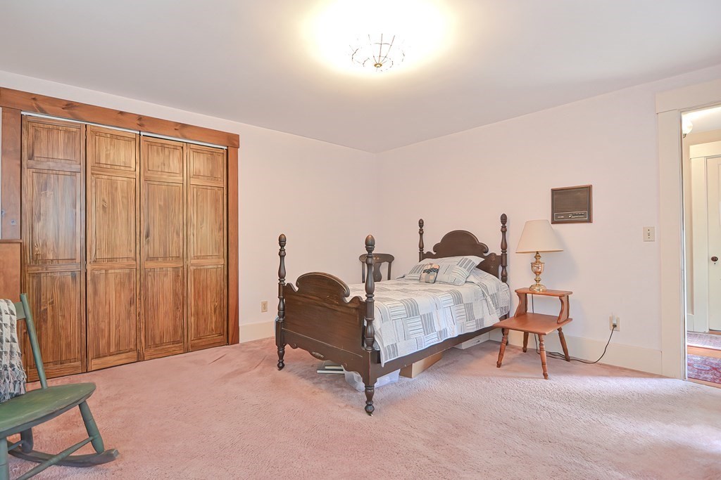 244 Davis Road Ashby, MA 01431 - Photo 21 of 35 a living room with furniture and a lamp
