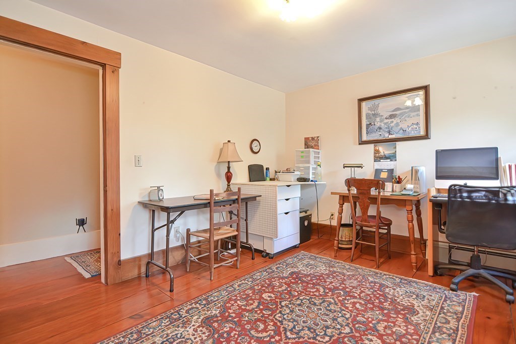 244 Davis Road Ashby, MA 01431 - Photo 23 of 35 a work room with furniture a rug and a window