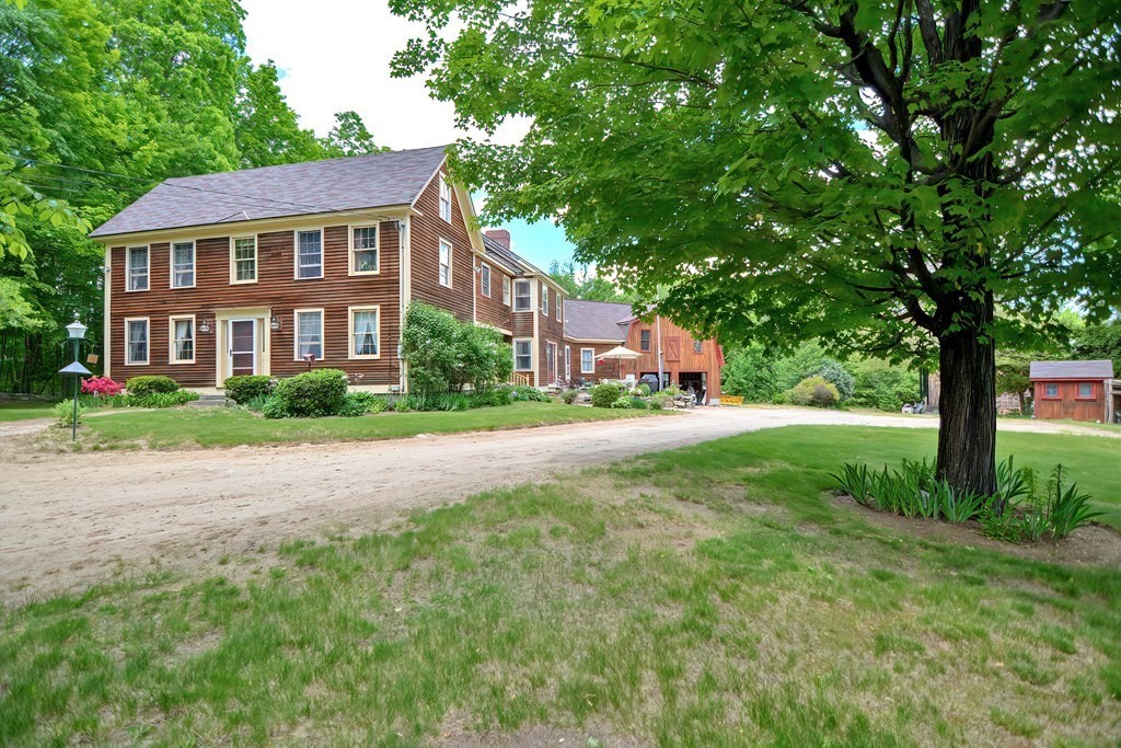 244 Davis Road Ashby, MA 01431 - Photo 29 of 35 a front view of a house with garden