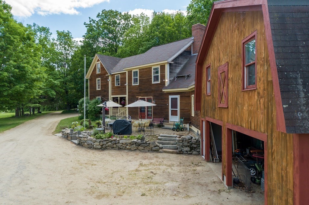 244 Davis Road Ashby, MA 01431 - Photo 8 of 35 a aerial view of a house with a yard