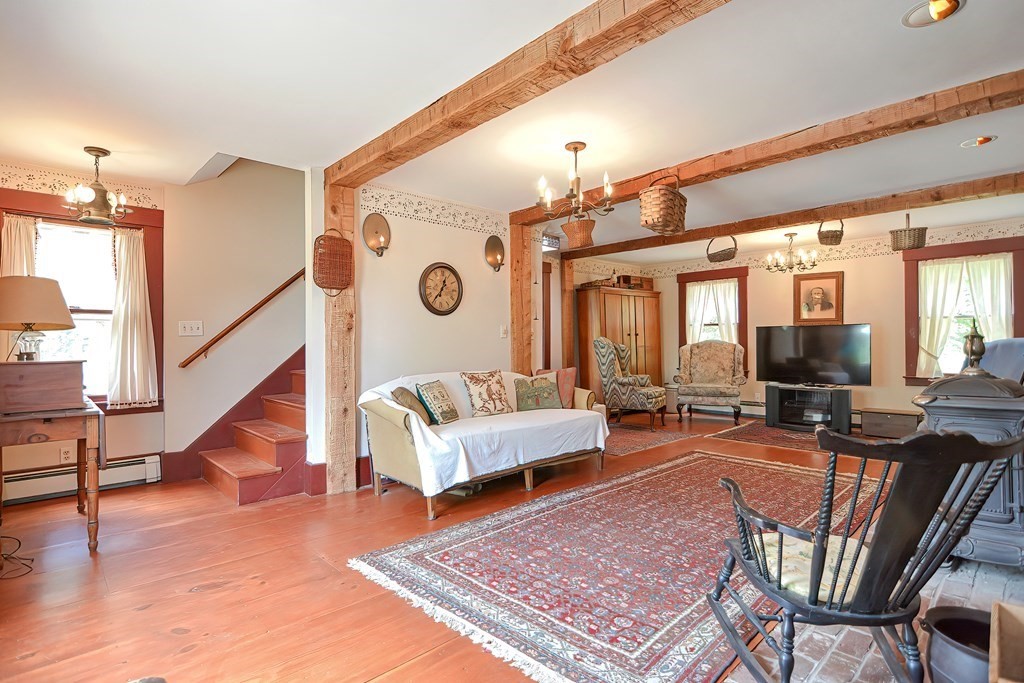 244 Davis Road Ashby, MA 01431 - Photo 10 of 35 a living room with furniture and wooden floor