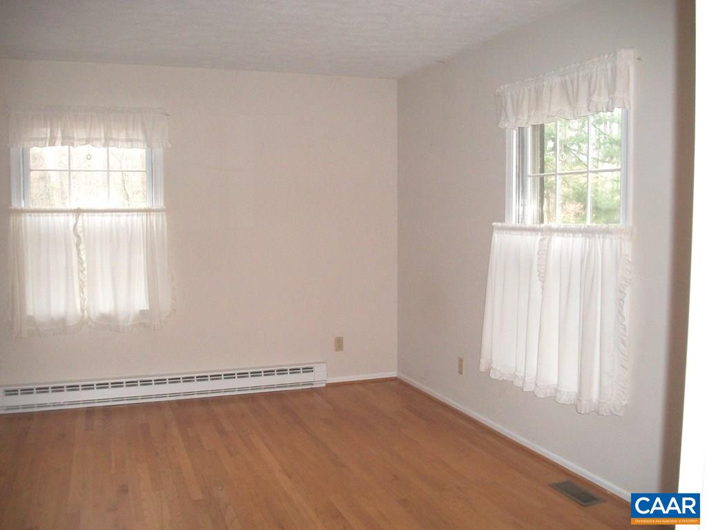 5584 Laurel Ridge Road Charlottesville, VA 22911 - Photo 19 of 28 an empty room with a window