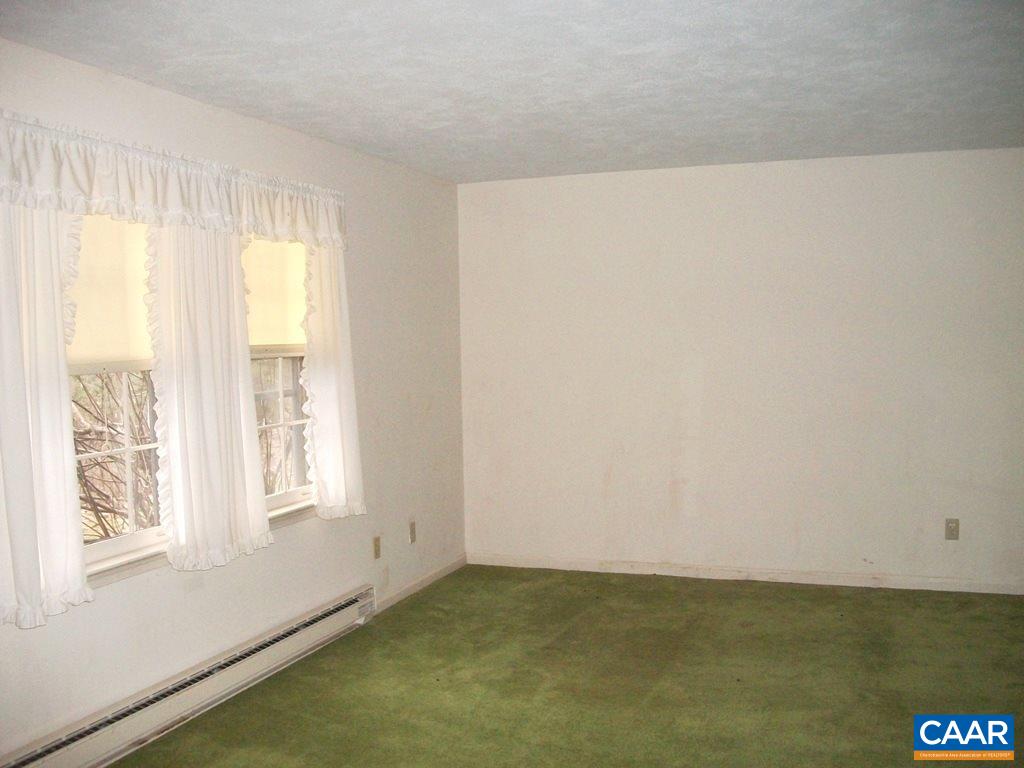 5584 Laurel Ridge Road Charlottesville, VA 22911 - Photo 20 of 28 a view of an empty room with a window