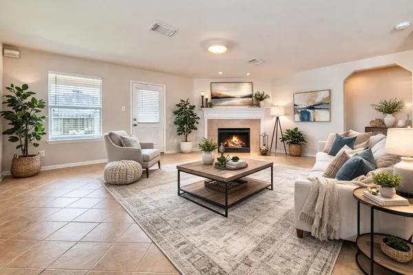 a living room with furniture and a fireplace