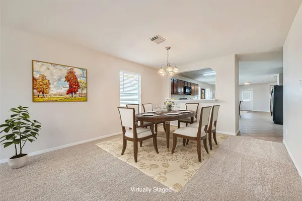 a view of a dining room with furniture