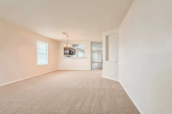 a view of a big room with windows and cabinet