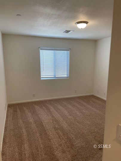 1104 South Yorktown Street Ridgecrest, CA 93555 - Photo 6 of 15 an empty room with a window