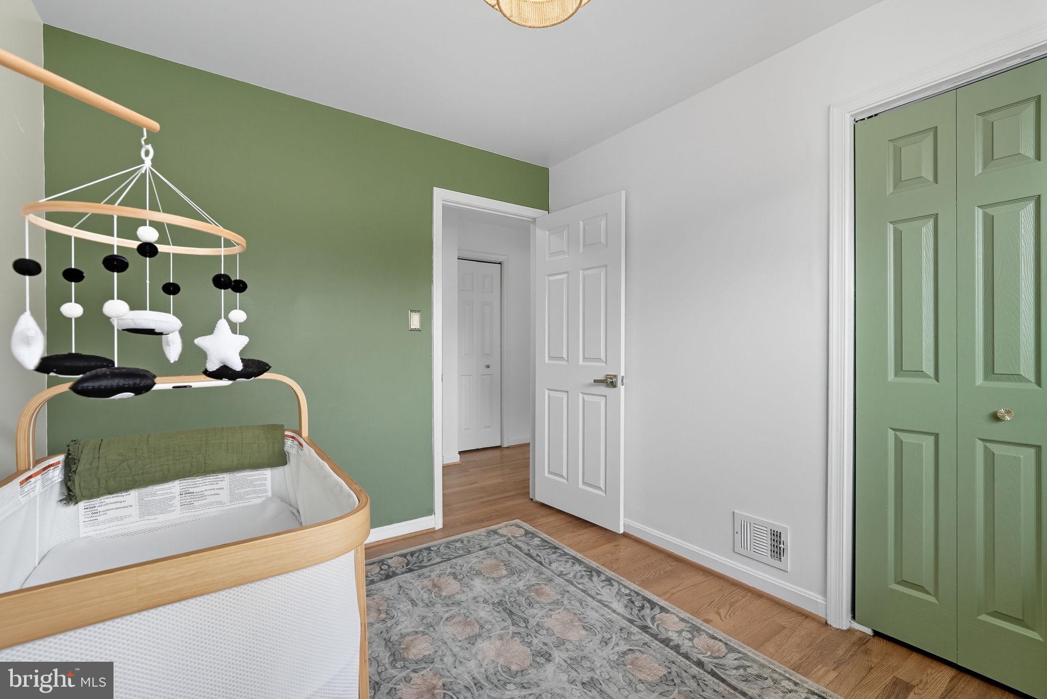 2411 Lillian Drive Silver Spring, MD 20902 - Photo 21 of 48 a bedroom with a bed and a mirror