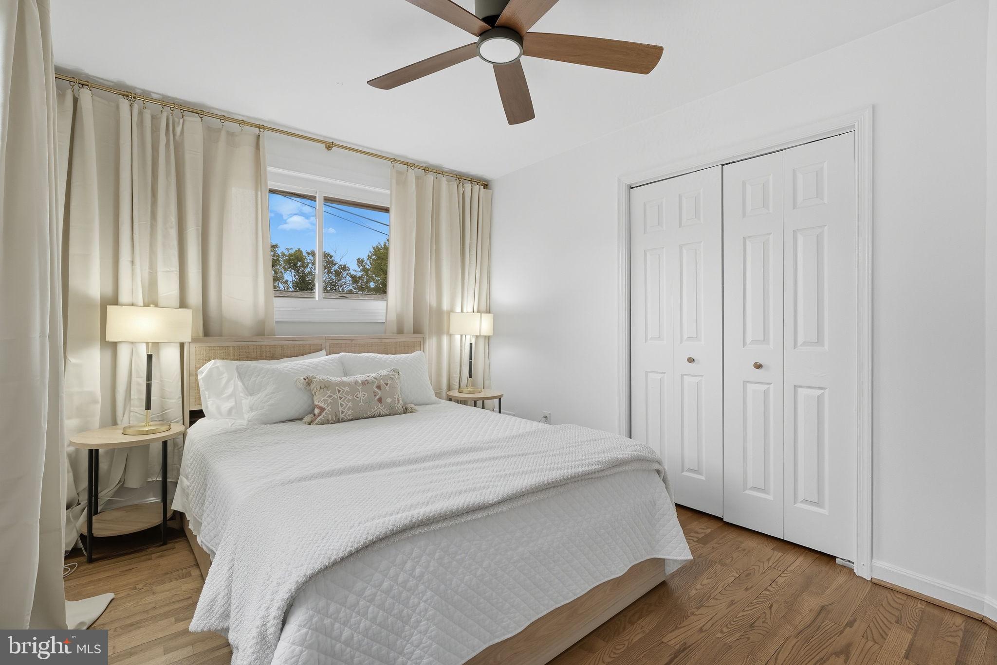 2411 Lillian Drive Silver Spring, MD 20902 - Photo 23 of 48 a bedroom with a bed and a painting on the wall