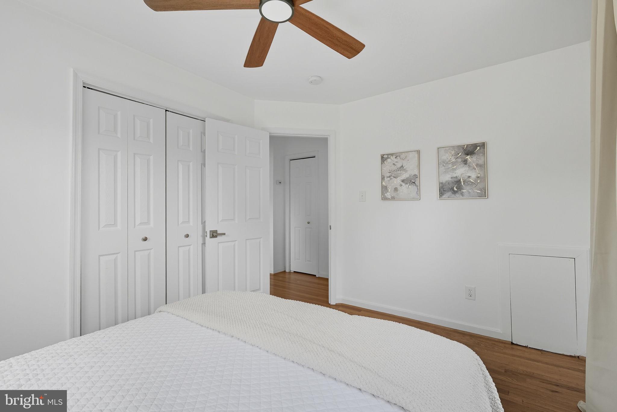 2411 Lillian Drive Silver Spring, MD 20902 - Photo 24 of 48 a bedroom with a bed and a chandelier