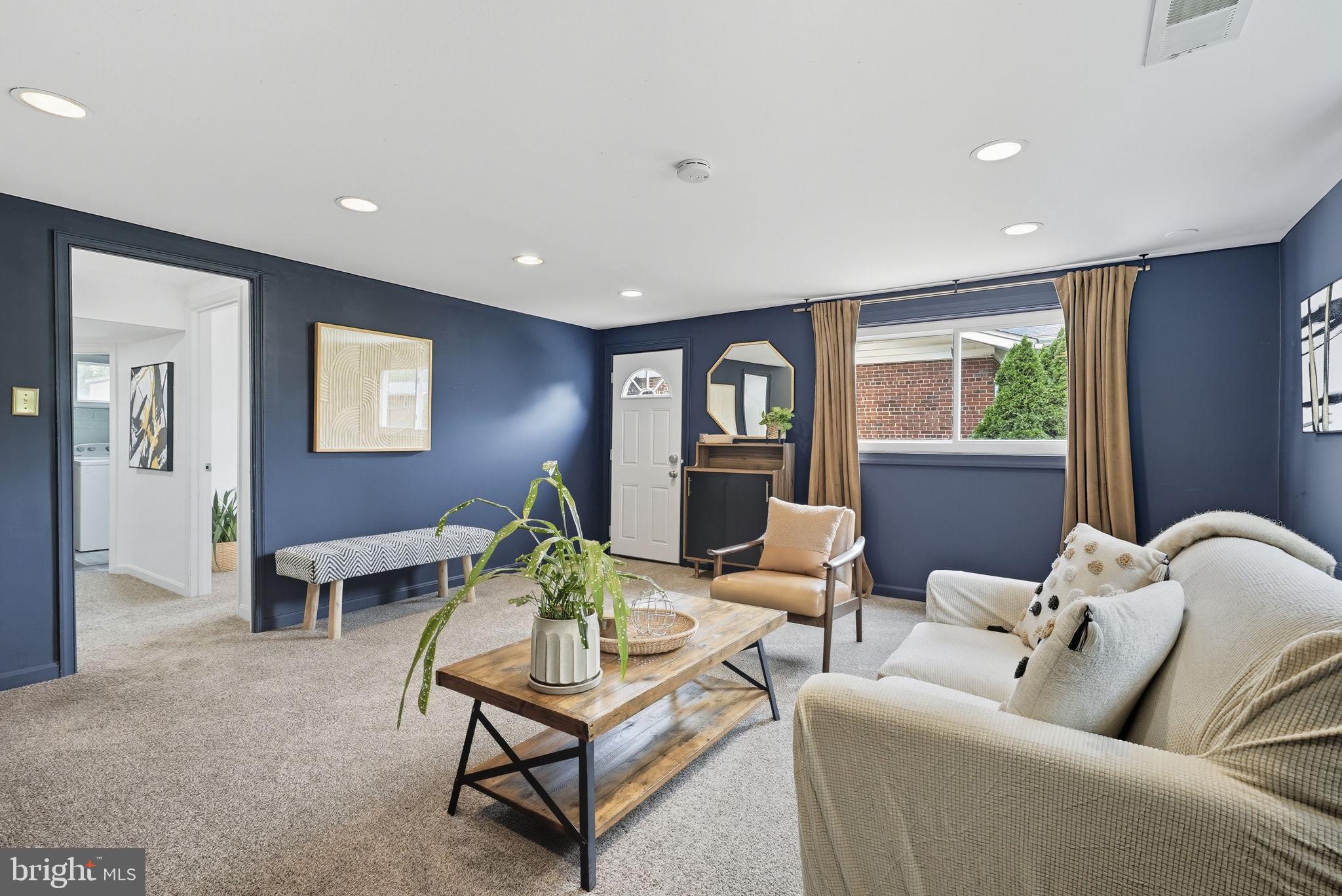 2411 Lillian Drive Silver Spring, MD 20902 - Photo 30 of 48 a living room with furniture and a wooden floor