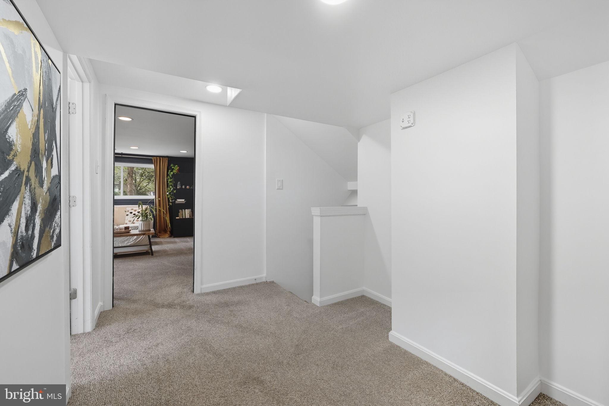 2411 Lillian Drive Silver Spring, MD 20902 - Photo 33 of 48 a view of a hallway with wooden shelves
