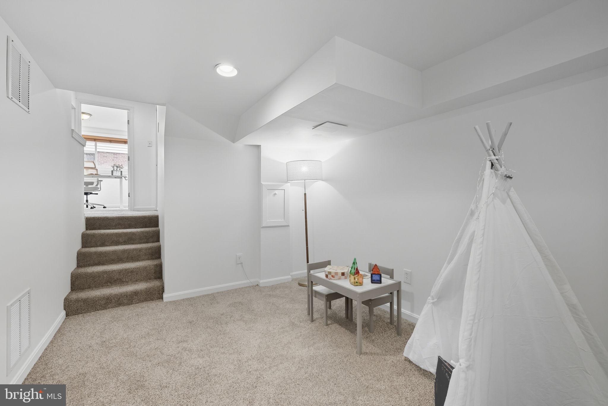 2411 Lillian Drive Silver Spring, MD 20902 - Photo 35 of 48 a living room with furniture and a wooden floor