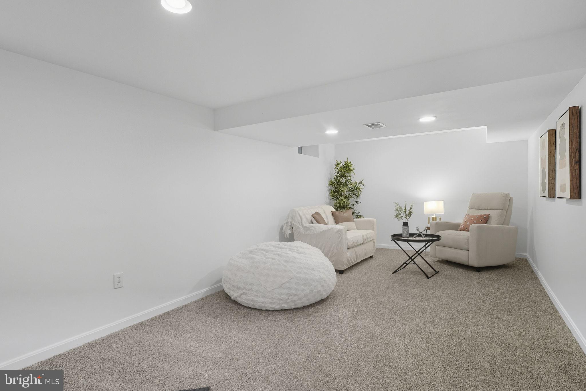 2411 Lillian Drive Silver Spring, MD 20902 - Photo 36 of 48 a living room with furniture and a lamp