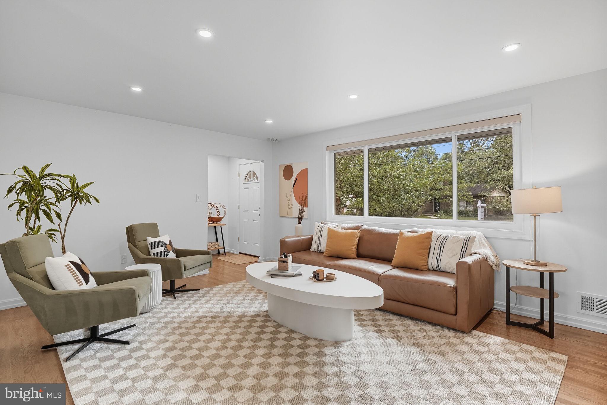 2411 Lillian Drive Silver Spring, MD 20902 - Photo 5 of 48 a living room with furniture and a large window
