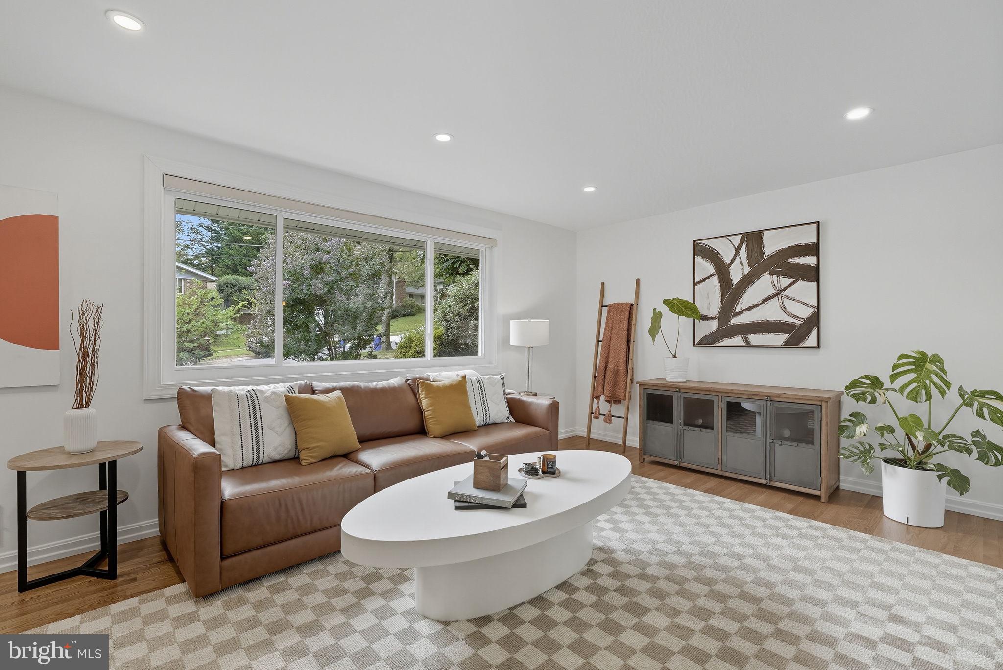 2411 Lillian Drive Silver Spring, MD 20902 - Photo 6 of 48 a living room with furniture and a large window
