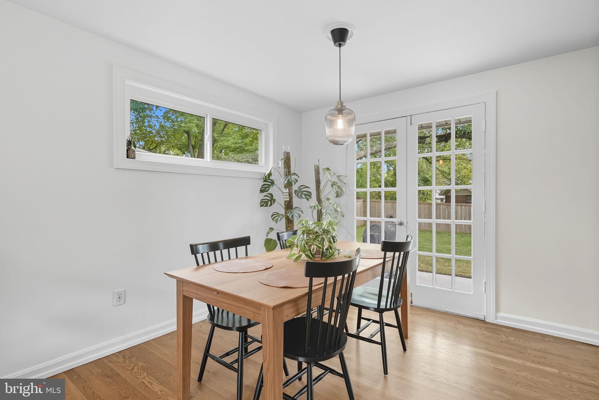 2411 Lillian Drive Silver Spring, MD 20902 - Photo 8 of 48 a view of a dining room with furniture window and wooden floor