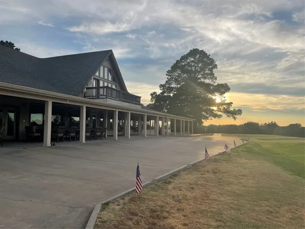 a view of a swimming pool and an outdoor seating