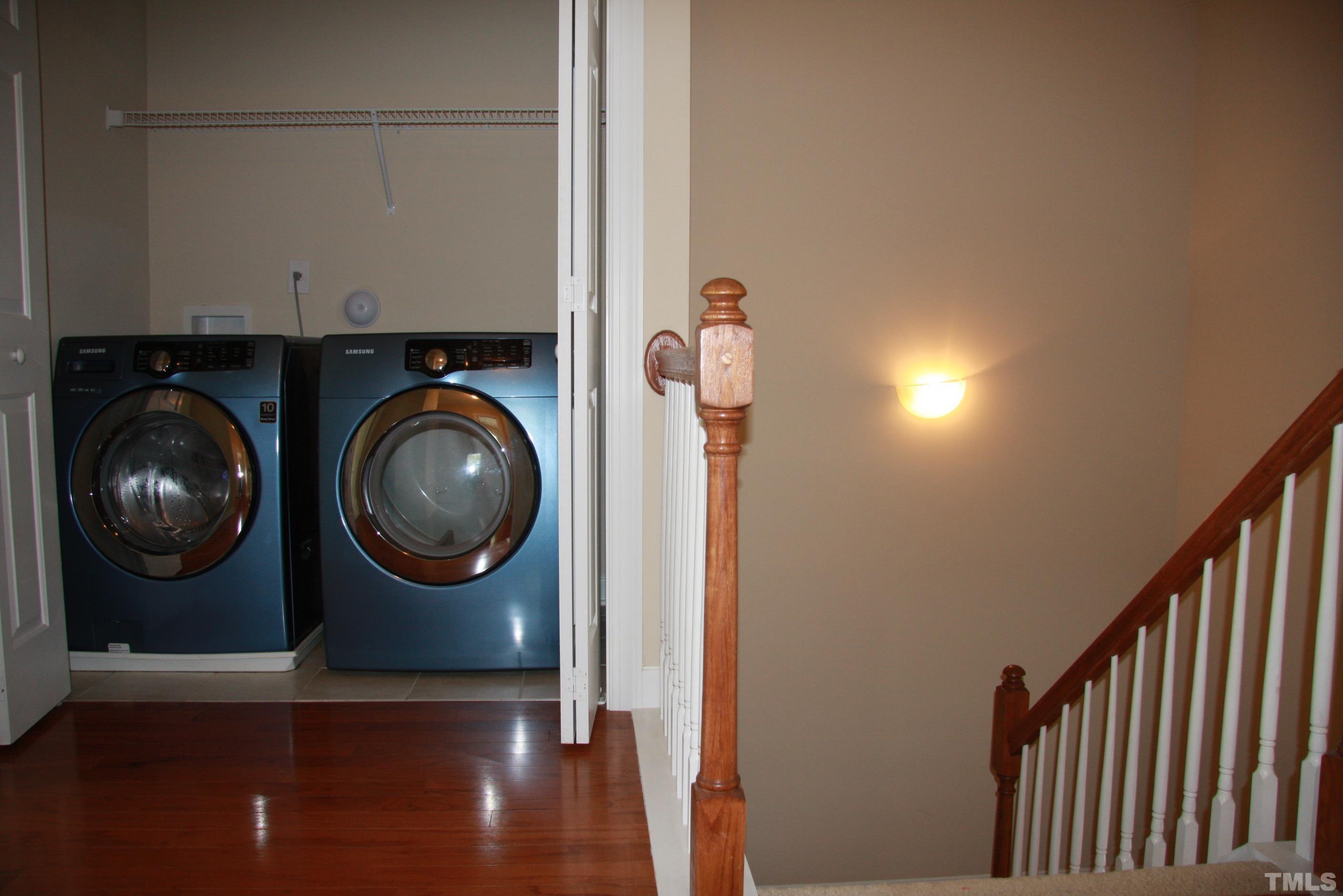 2021 Chancellor Place Raleigh, NC 27603 - Photo 16 of 30 a view of a livingroom with washer and dryer