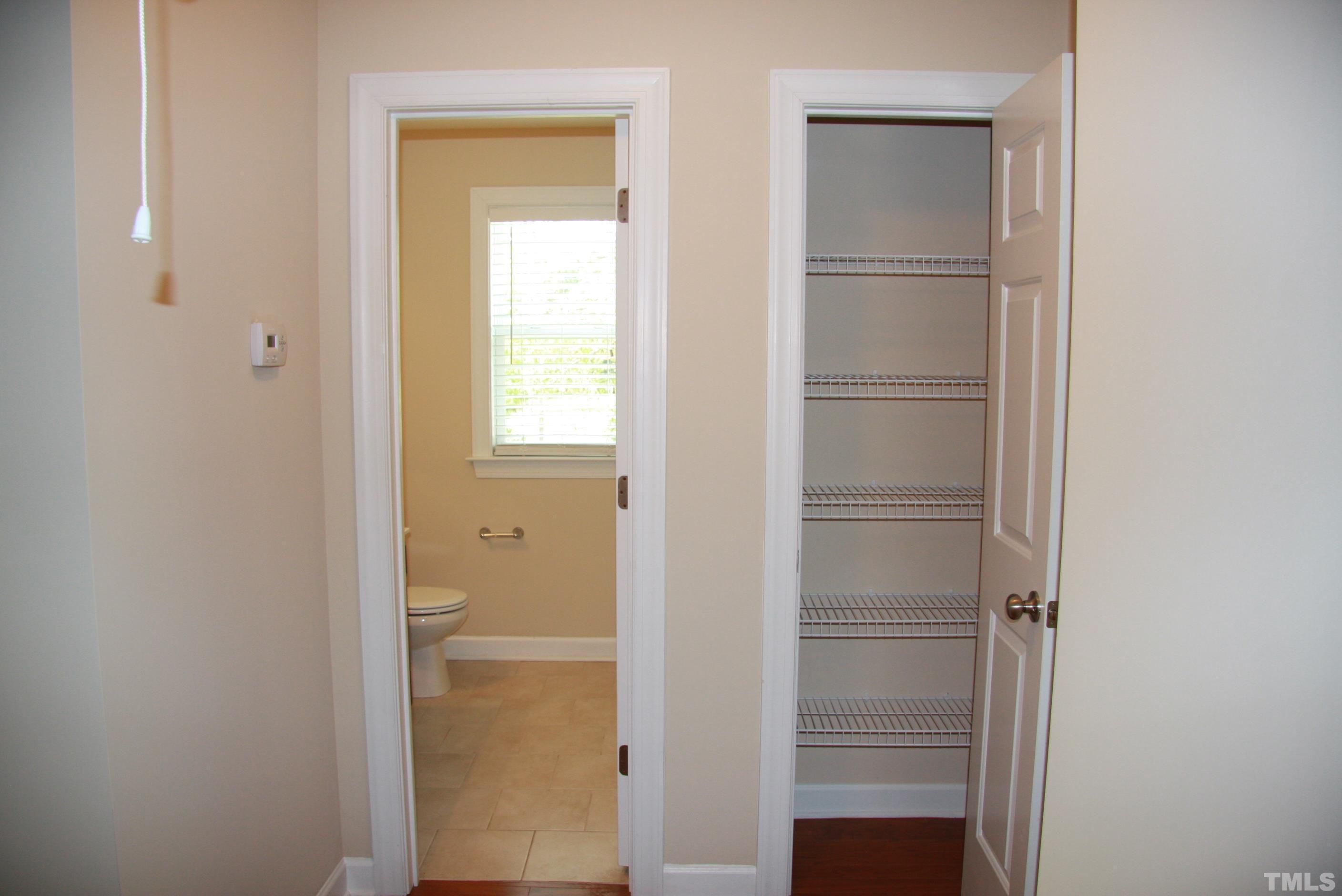 2021 Chancellor Place Raleigh, NC 27603 - Photo 22 of 30 a view of bathroom with a closet and mirror