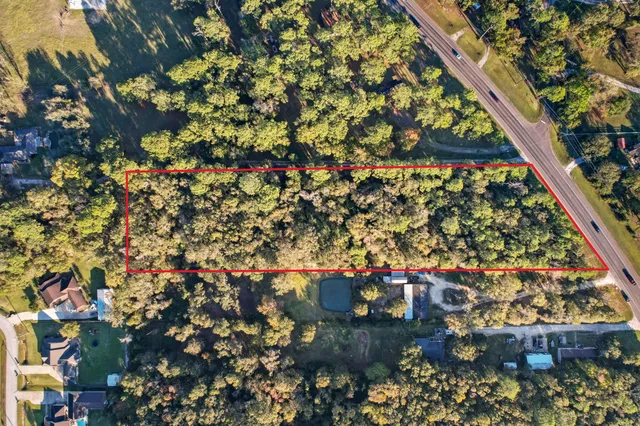 an aerial view of a residential houses and city street