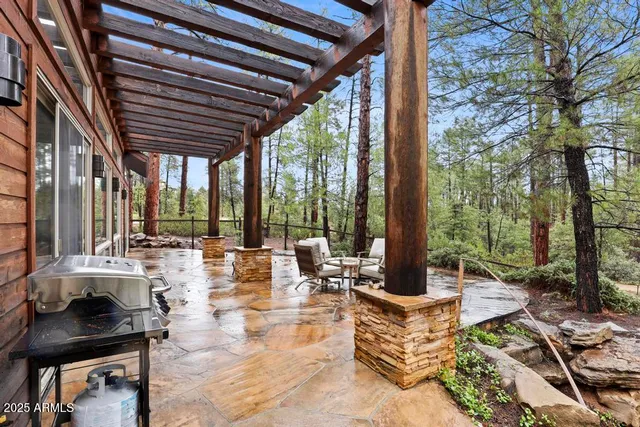 a patio with a table and chairs