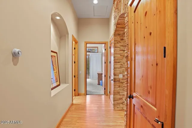 a room with wooden furniture and a rug
