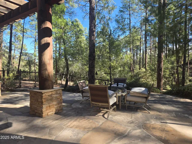 a view of a backyard with sitting area