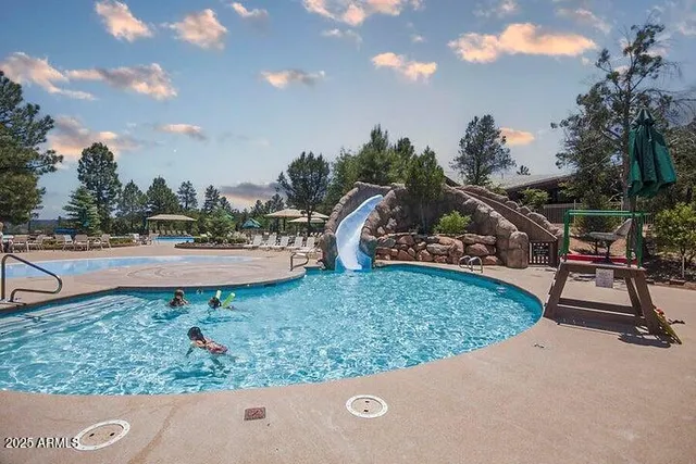 a view of a patio with swimming pool